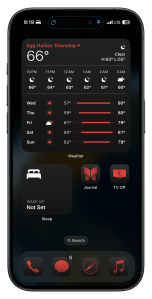 an iPhone 15 pro Home Screen tinted red in sleep focus
